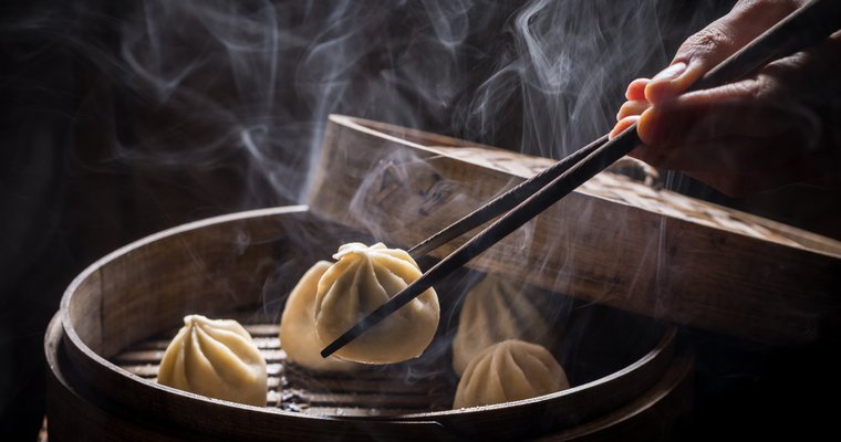 a dumpling in a steamer basket