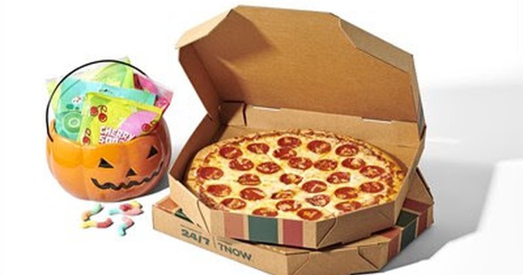 image shows pizza and pumpkin head filled with candy