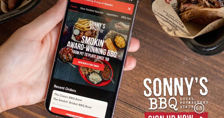 A hand holding smartphone with Sonny's BBQ app displayed
