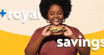 woman holding a Burger King Whopper.