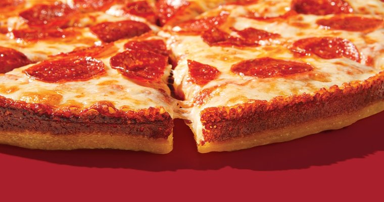 a pepperoni pizza on a red background