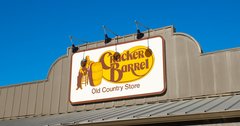 Exterior front exterior facade sign logo for restaurant chain Cracker Barrel Old Country and gift store.