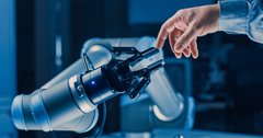 Futuristic Robot Arm Touches Human Hand in Humanity and Artificial Intelligence Unifying Gesture