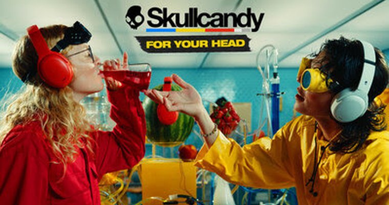 women drinking liquid under skullcandy logo