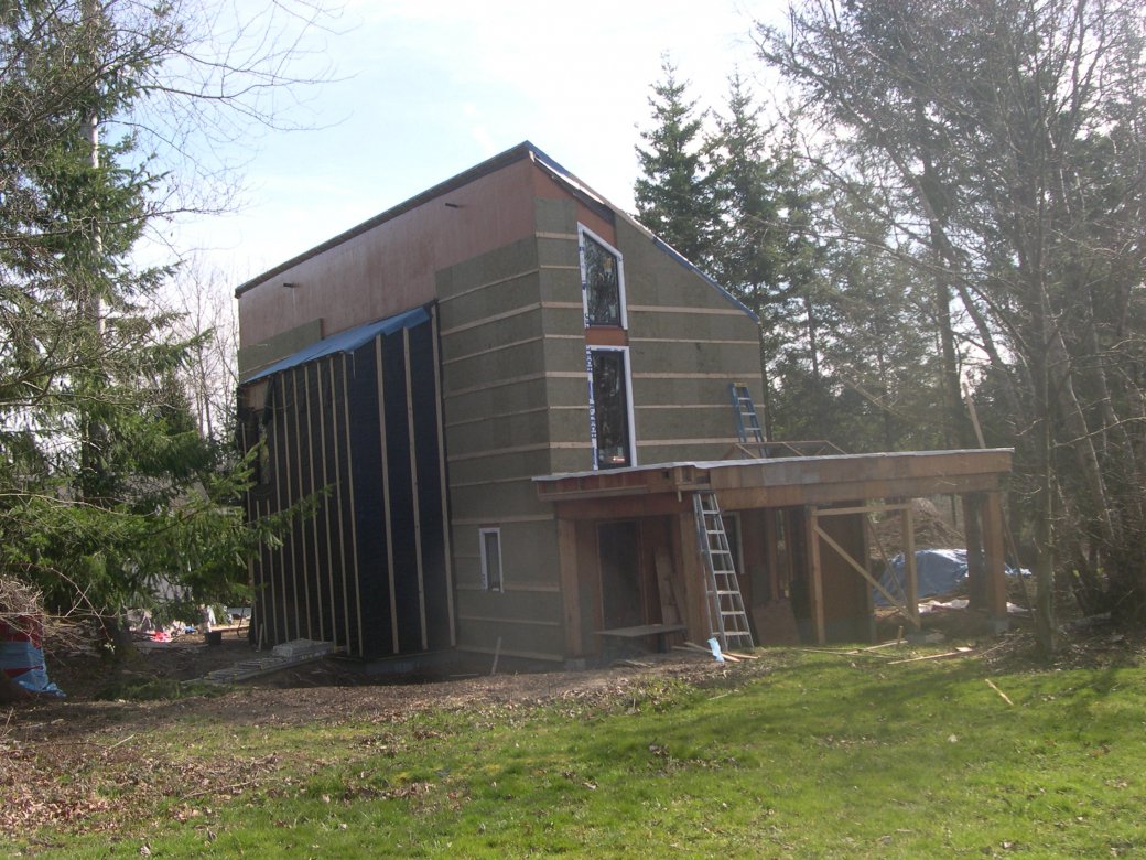 over the 2 by 6 framing the builder installed a continuous thermal blanket