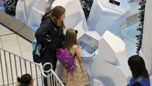Kiosks help ready families for photos with Santa