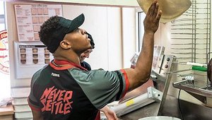 Wisconsin star RB Taylor takes a turn as Toppers Pizza franchisee